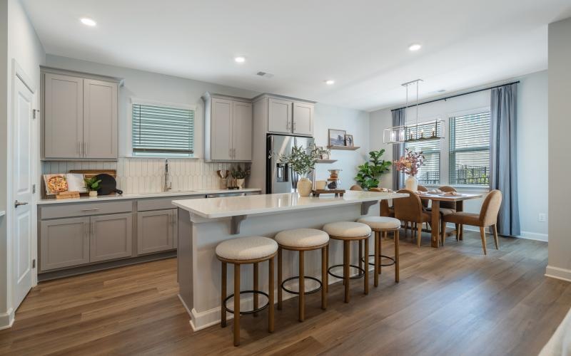 a kitchen with bar stools