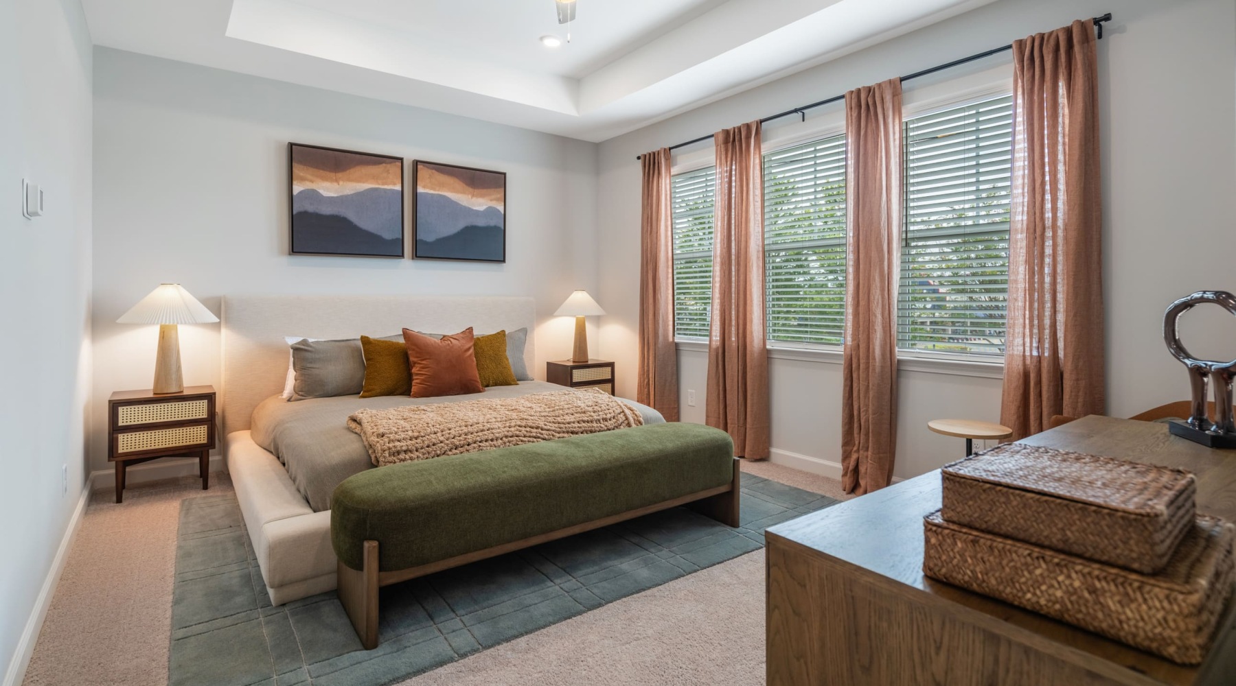 bedroom with a large window and modern decor